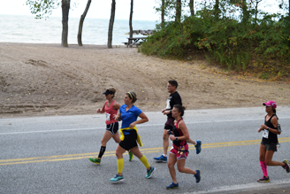 Erie Marathon on Presque Isle racers running along Lake Erie and natural sand beaches.